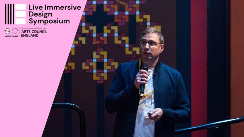 Photo of Chris Lattner speaking at the Live Immersive Design Symposium in October 2023