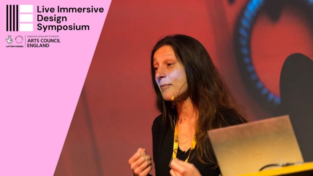 Photo of Marie Klimis presenting at the Live Immersive Design Symposium in October 2023