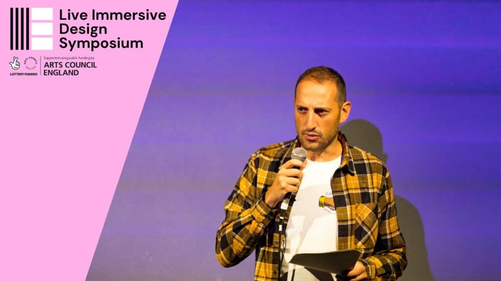 Photo of Alessandro Giovannuci presenting at the Live Immersive Design Symposium in October 2023