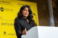 Speaker at a conference podium