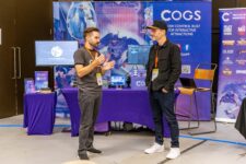 Two people discussing at a booth